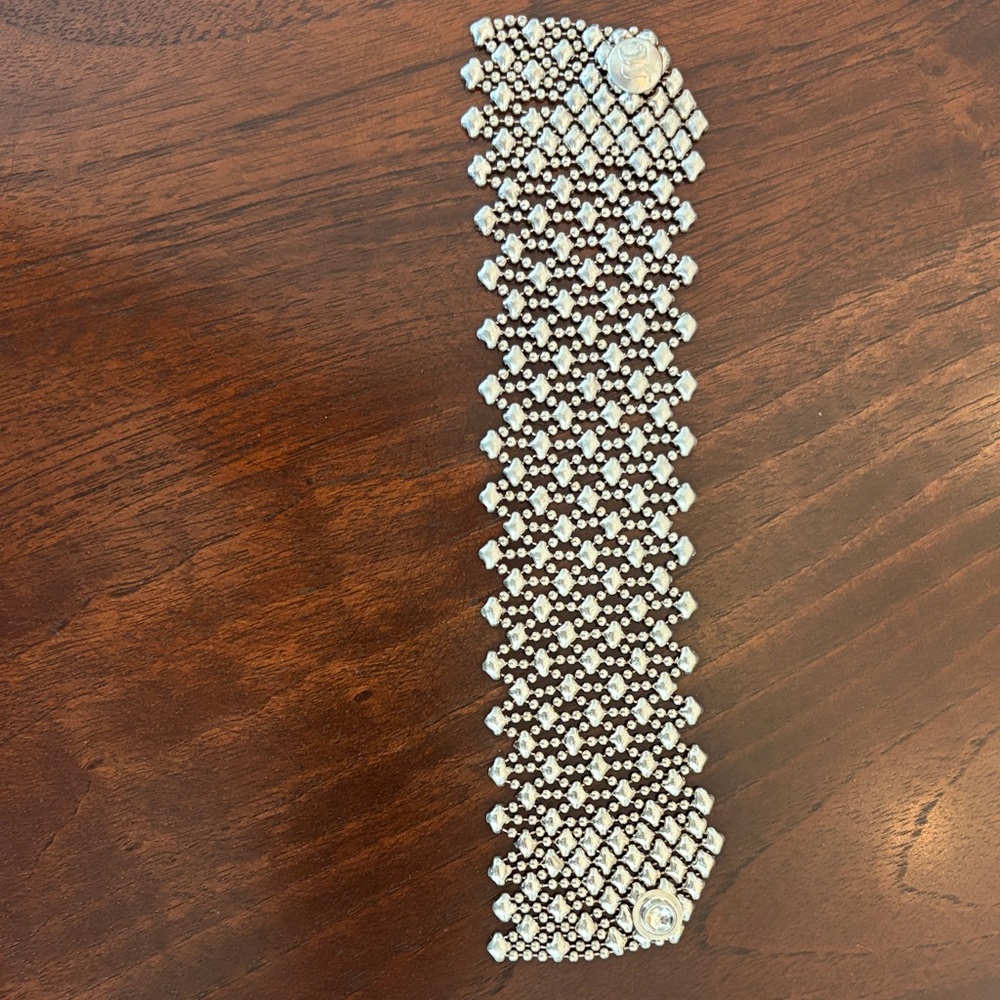 Sergio Gutierrez Liquid Metal cuff bracelet in an antique silver finish